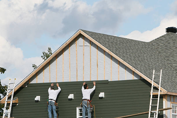 Professional Siding Contractor technician working in Towson, MD